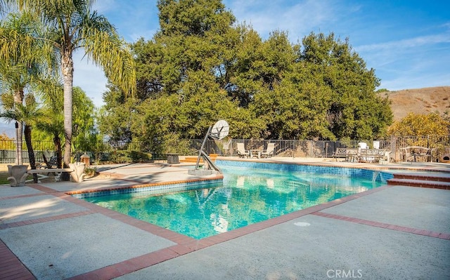 view of pool featuring a patio area