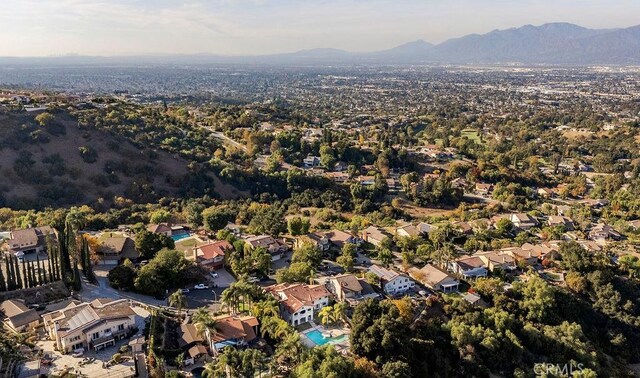 birds eye view of property with a mountain view