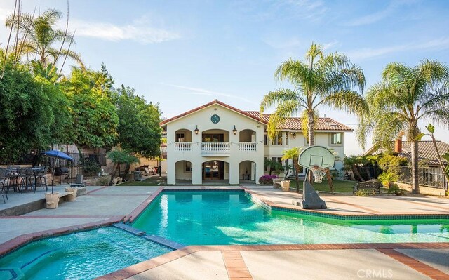 view of pool featuring a patio