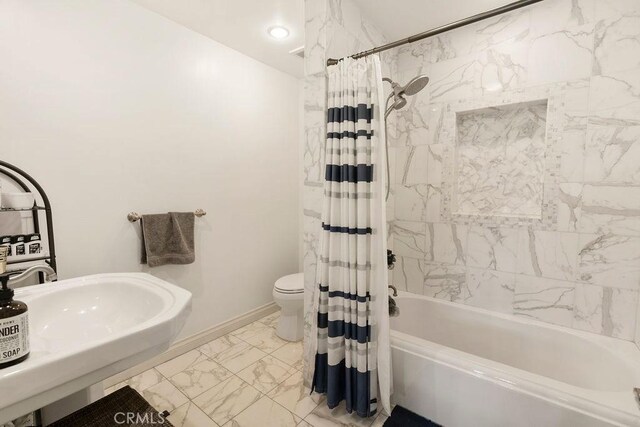 full bathroom with toilet, sink, and shower / tub combo with curtain