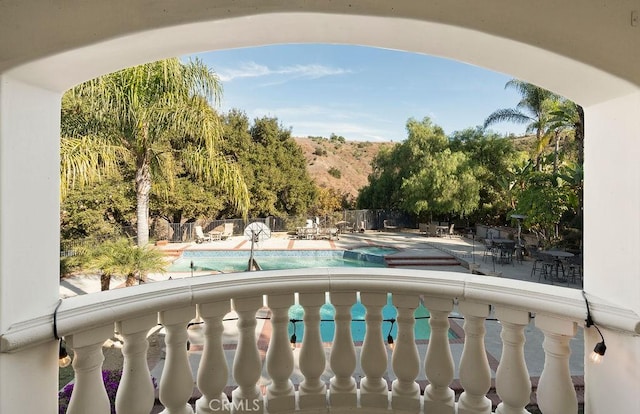 view of swimming pool with a jacuzzi