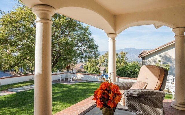 view of patio / terrace with a mountain view