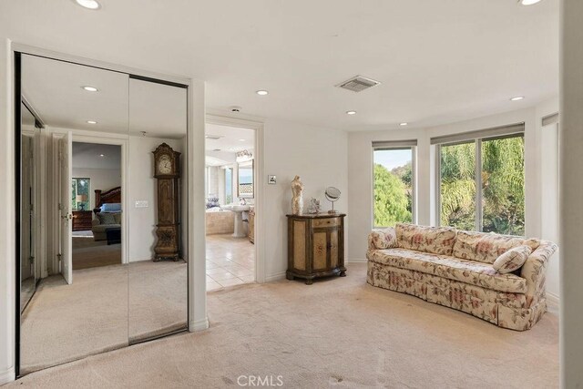 sitting room with light colored carpet