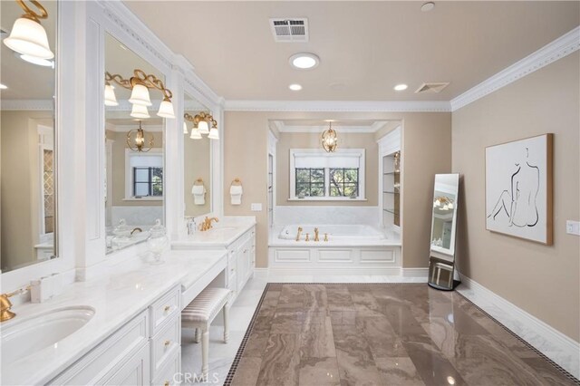 bathroom featuring built in shelves, vanity, a washtub, and ornamental molding