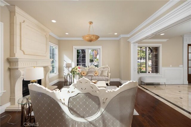 interior space with dark hardwood / wood-style floors, a wealth of natural light, and ornamental molding