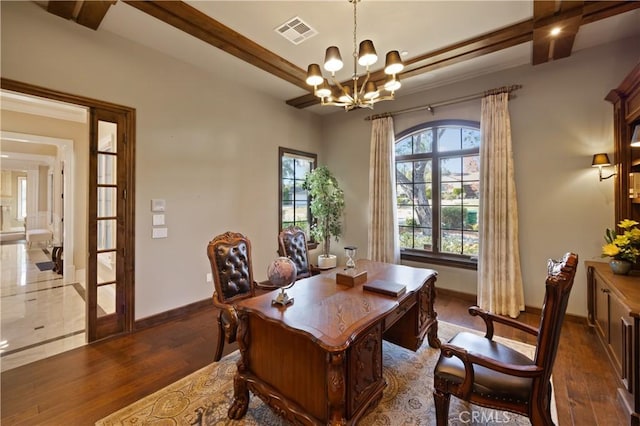 dining area featuring dark wood-type flooring, french doors, and an inviting chandelier