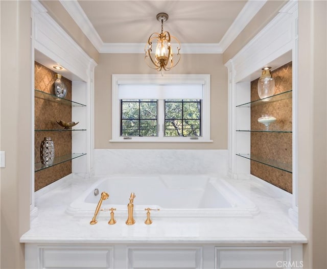 bathroom featuring built in shelves, a bathtub, crown molding, and a chandelier