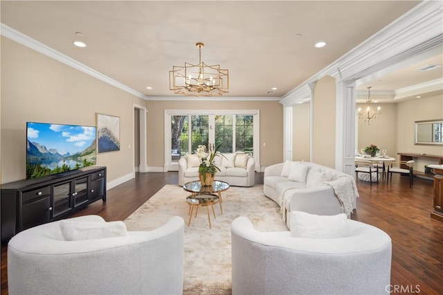 living room featuring ornamental molding, dark hardwood / wood-style floors, and a notable chandelier