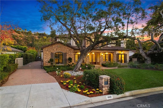 view of front of house with a lawn