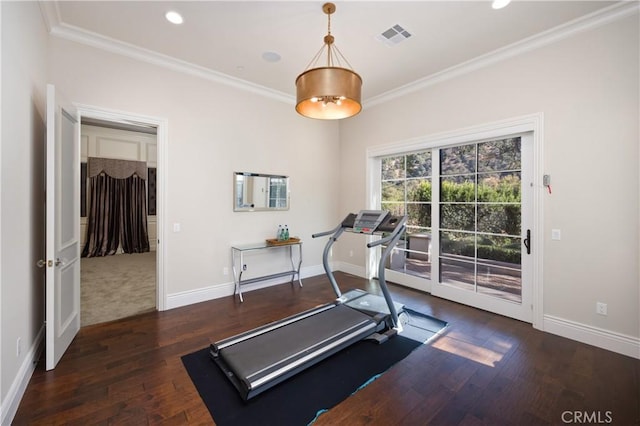 workout room featuring dark hardwood / wood-style floors and ornamental molding