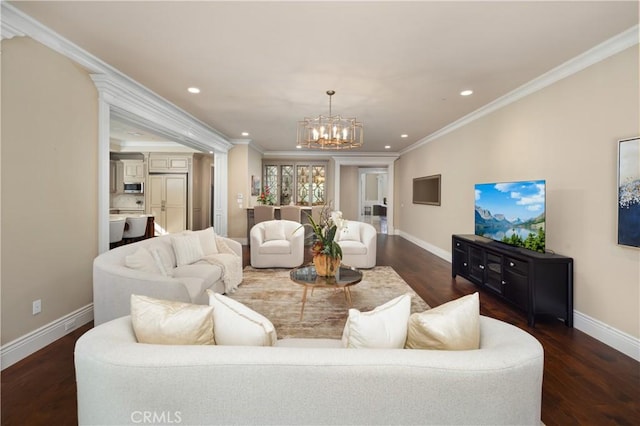 living room featuring an inviting chandelier, dark wood-type flooring, and crown molding