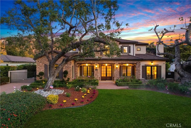 view of front of home with a lawn