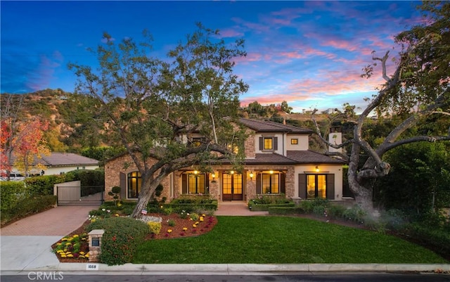 view of front of home with a yard