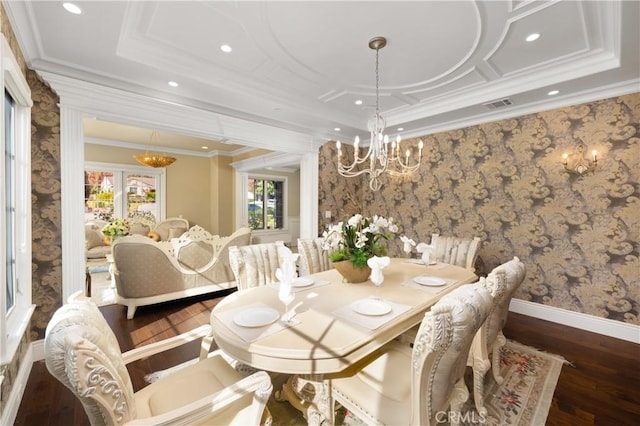 dining room featuring an inviting chandelier, dark hardwood / wood-style floors, and crown molding