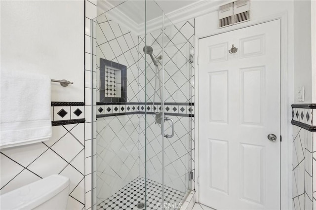 full bath featuring toilet, visible vents, tile walls, a stall shower, and crown molding