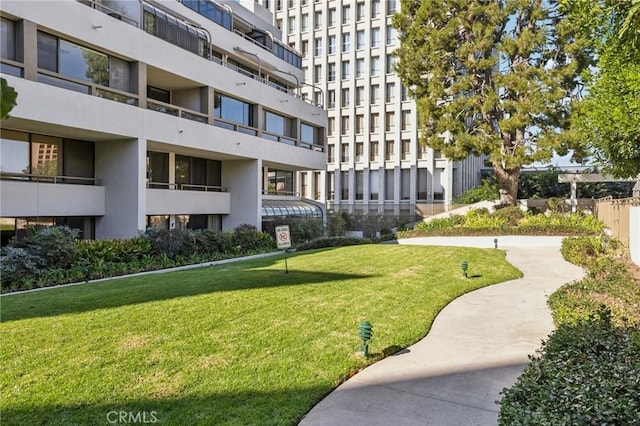 view of home's community with a lawn