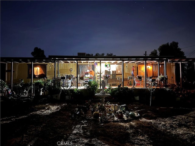 view of back house at night