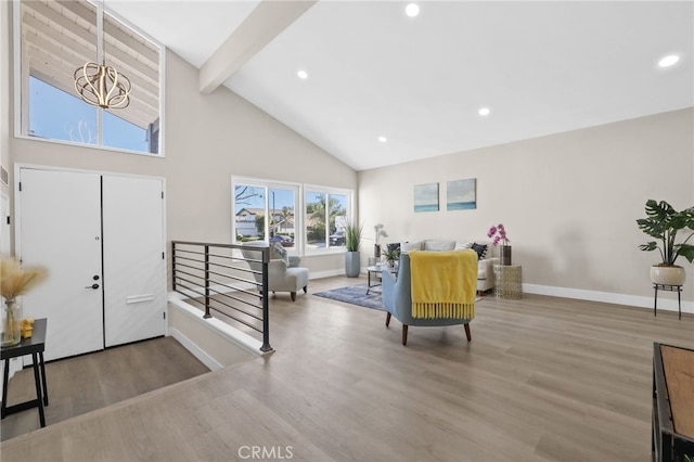 entryway featuring hardwood / wood-style floors, high vaulted ceiling, a chandelier, and beamed ceiling