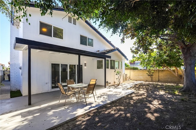 back of house with a patio area