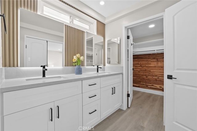 bathroom with vanity and wood-type flooring