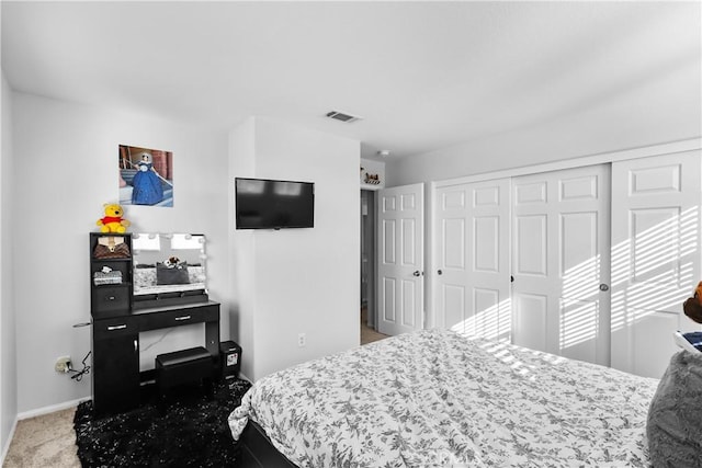 carpeted bedroom featuring a closet