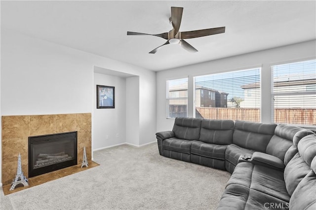 living room featuring plenty of natural light, ceiling fan, and light colored carpet