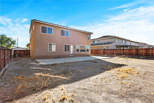 rear view of property with a patio area