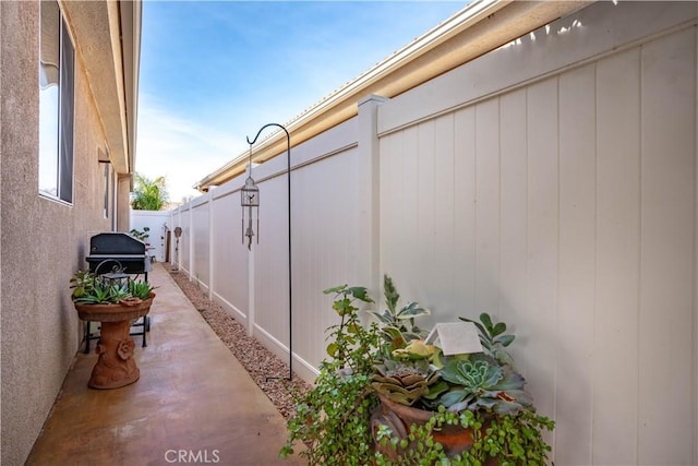 view of property exterior featuring a patio area