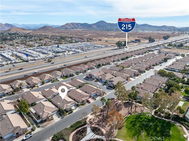 birds eye view of property featuring a mountain view