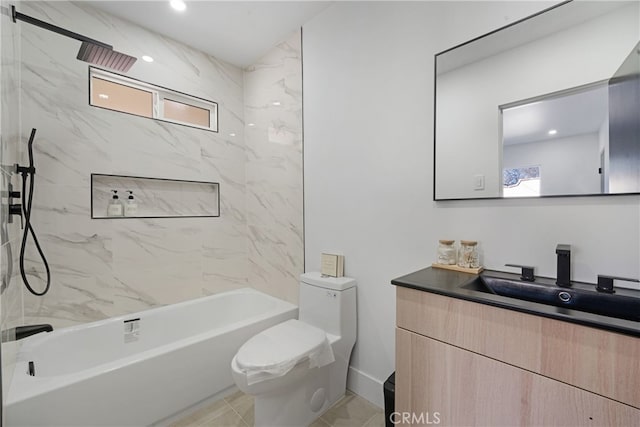 full bathroom with vanity, a wealth of natural light, tiled shower / bath, and toilet