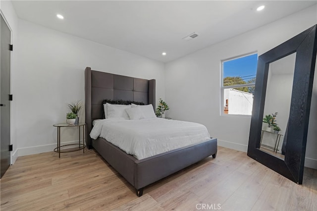 bedroom with light hardwood / wood-style flooring