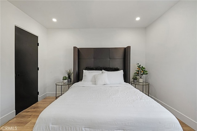 bedroom featuring wood-type flooring