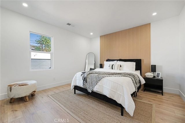 bedroom with light hardwood / wood-style floors