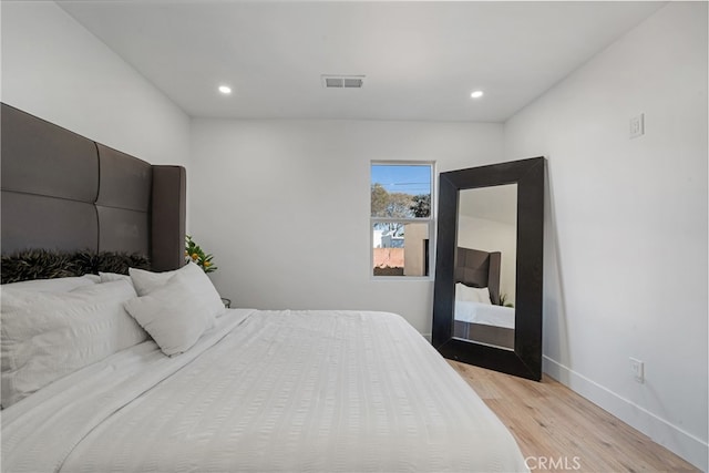 bedroom featuring light hardwood / wood-style floors