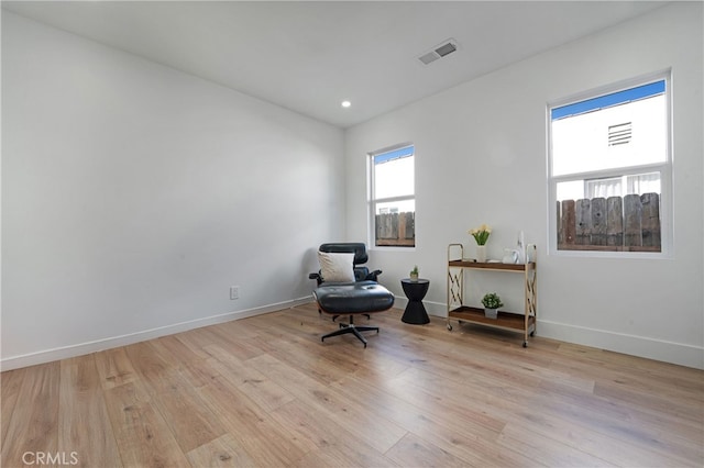 sitting room featuring light hardwood / wood-style floors