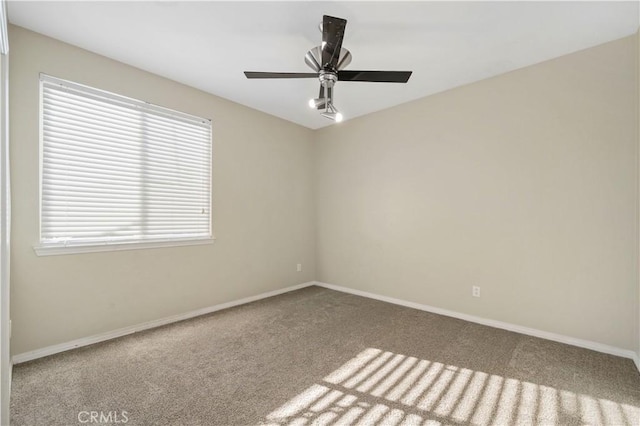 carpeted empty room with ceiling fan