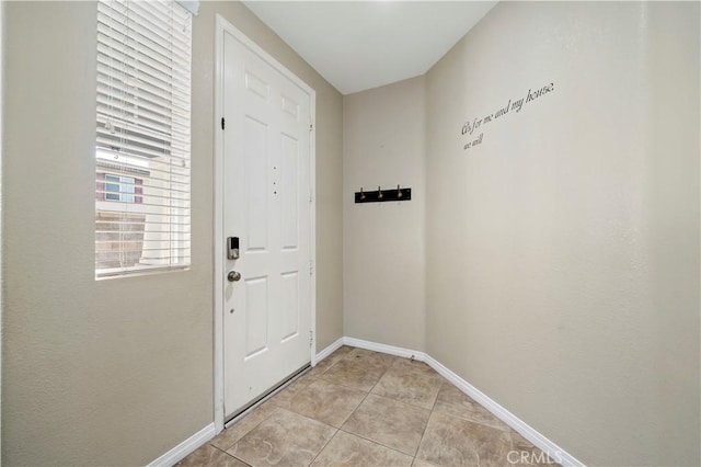 doorway featuring light tile patterned floors