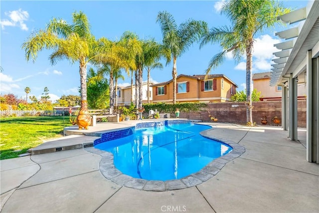 view of pool with a patio area and a lawn