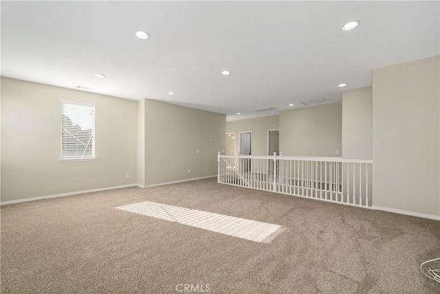 unfurnished room with light colored carpet