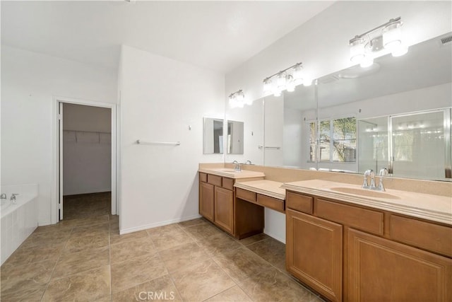 bathroom featuring vanity, independent shower and bath, and tile patterned flooring