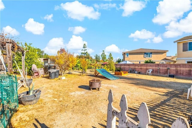 exterior space with a fire pit