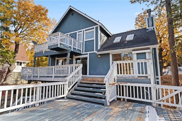918 Sandalwood Dr, Lake Arrowhead, CA 92352 - back of property with a deck, a balcony, a chimney, and roof with shingles