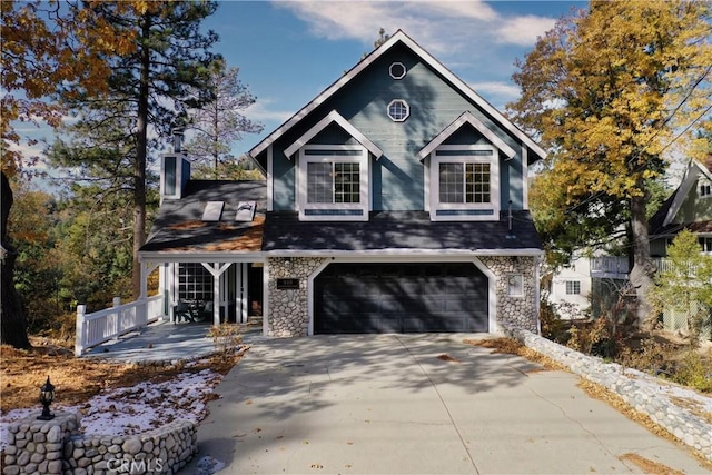 918 Sandalwood Dr, Lake Arrowhead, CA 92352 - view of front of property with a garage, driveway, and stone siding