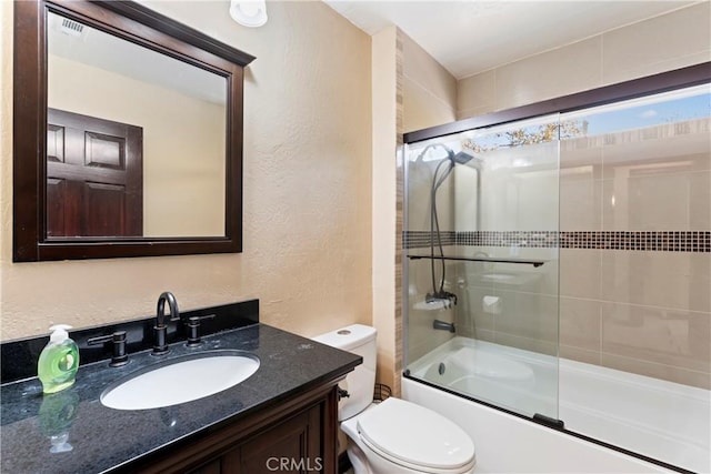 918 Sandalwood Dr, Lake Arrowhead, CA 92352 - bathroom featuring a textured wall, enclosed tub / shower combo, and vanity