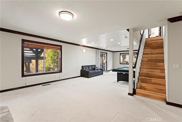 interior space featuring light carpet, ornamental molding, and pool table