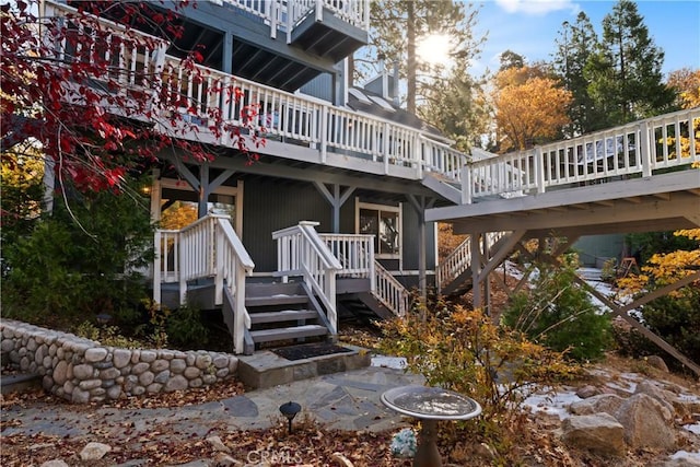 918 Sandalwood Dr, Lake Arrowhead, CA 92352 - rear view of house with stairway and a wooden deck