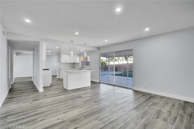 unfurnished living room with light hardwood / wood-style floors