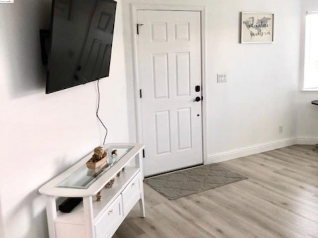 foyer with light hardwood / wood-style flooring