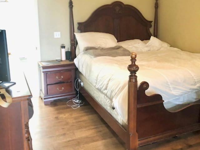 bedroom featuring hardwood / wood-style floors