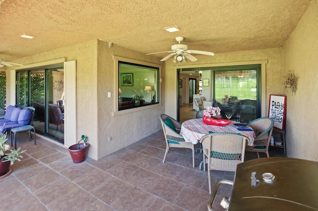 view of patio / terrace featuring ceiling fan